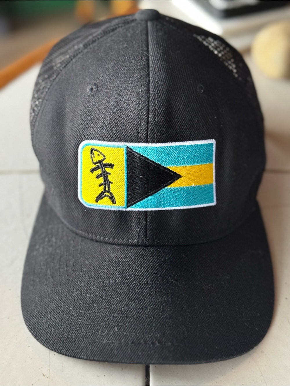 Black Trucker Hat with Colorful Flag Patch